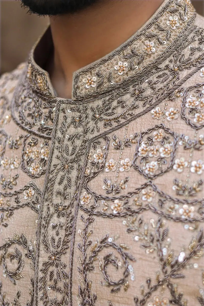Beige embroidered sherwani from ahsan tariq ishq collection with silver gold threadwork floral motifs and sequin detailing
