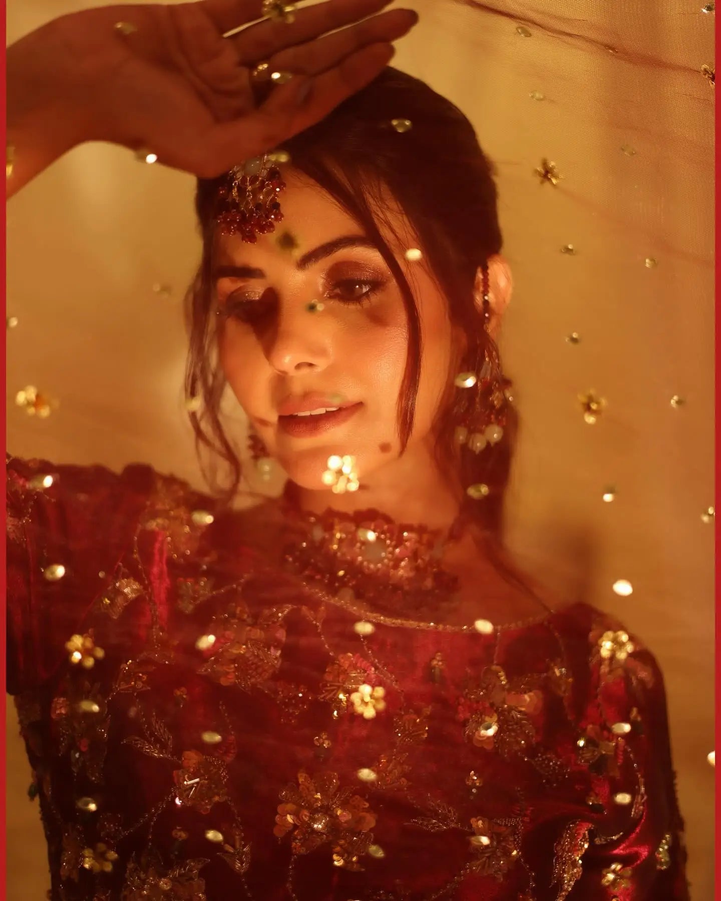 A richly embroidered red velvet top with gold floral patterns and sequins from the rang-e-mahal romance fall winter collection
