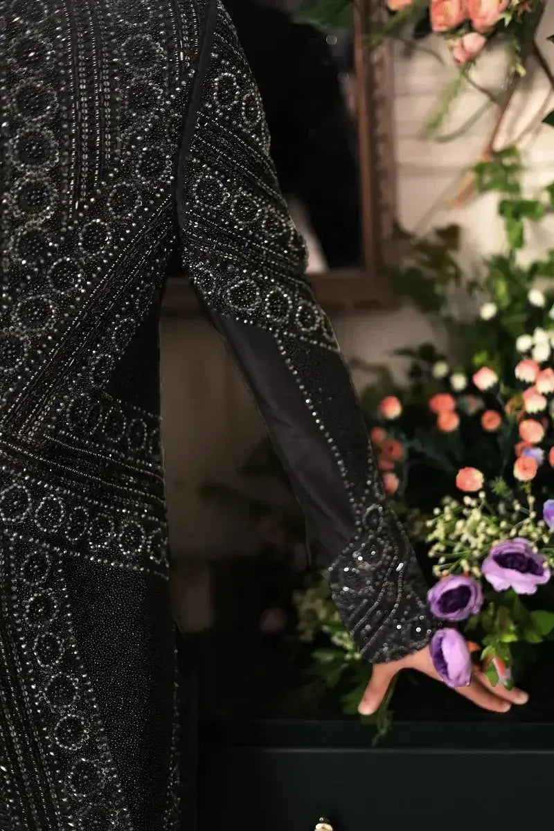 Black embellished gown with intricate silver beading and geometric patterns from ranjeet singh royal collection