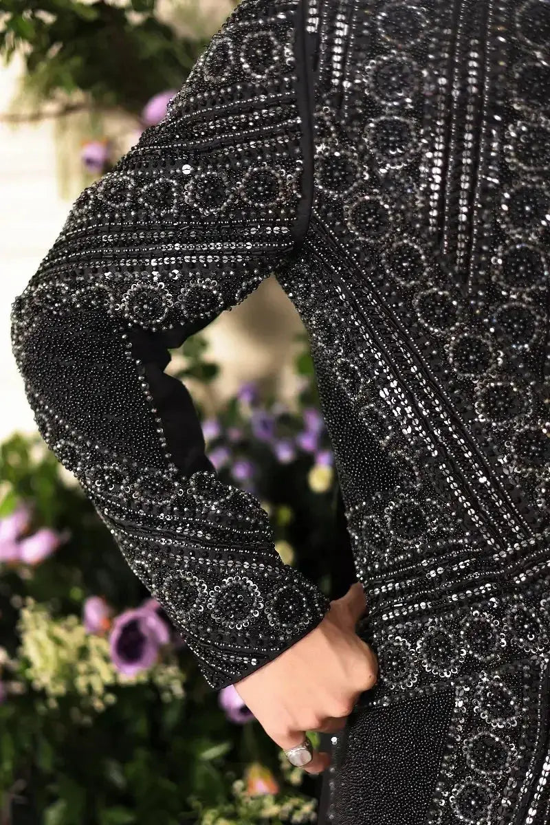 Ranjeet Singh Royal black sequined and beaded long sleeved dress with intricate circular patterns for elegant occasions