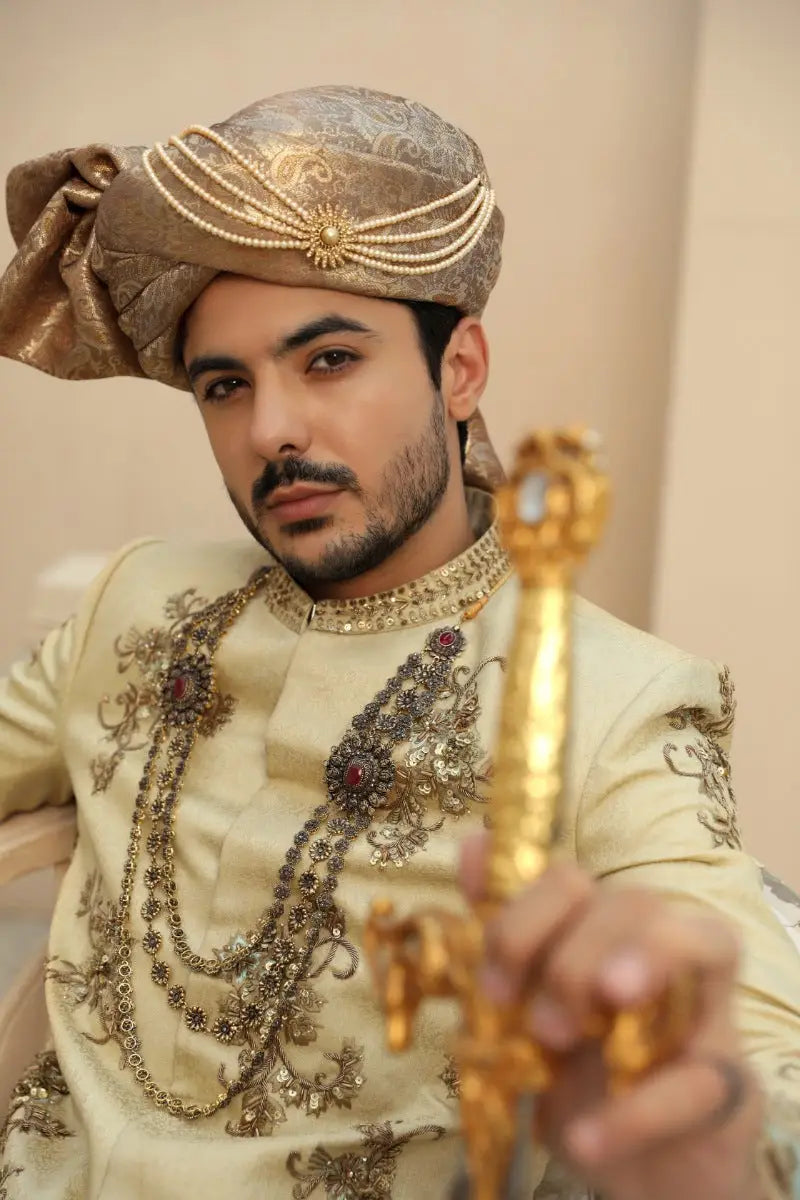 Gold ornate ceremonial dagger sahar with intricate filigree jeweled hilt from raqeeb se collection antique gold prince coat