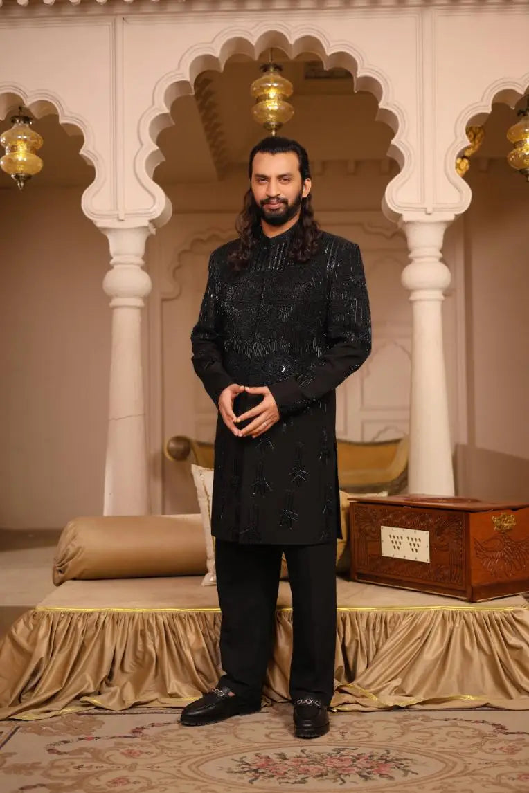 Black embroidered sherwani shahenshah with intricate silver thread detailing showcasing craftsmanship
