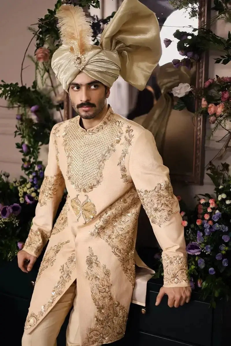 Beige embroidered sherwani with gold thread detailing and matching feathered turban from shairshah collection