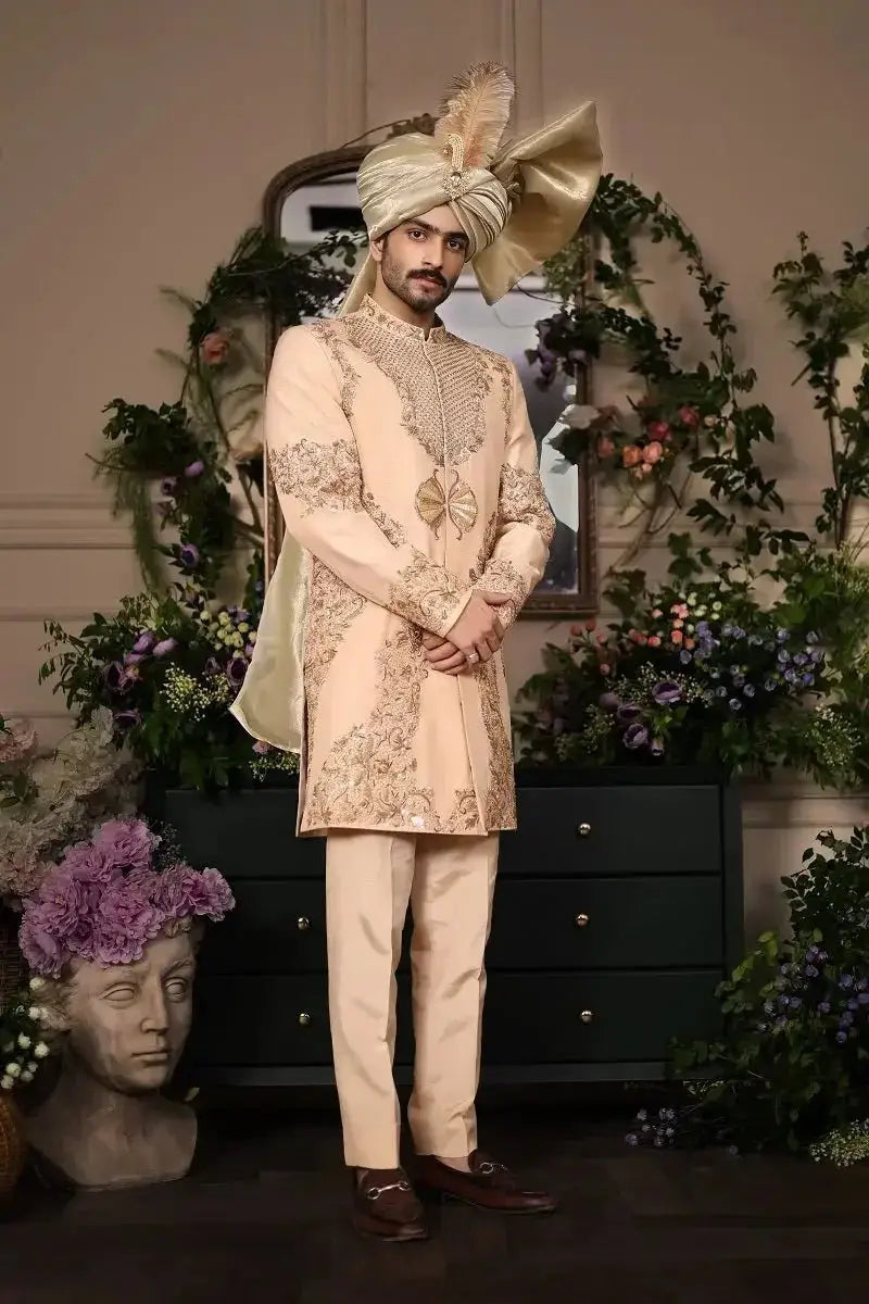 Beige embroidered Sherwani Shairshah with gold thread detailing and matching turban adorned with large bow