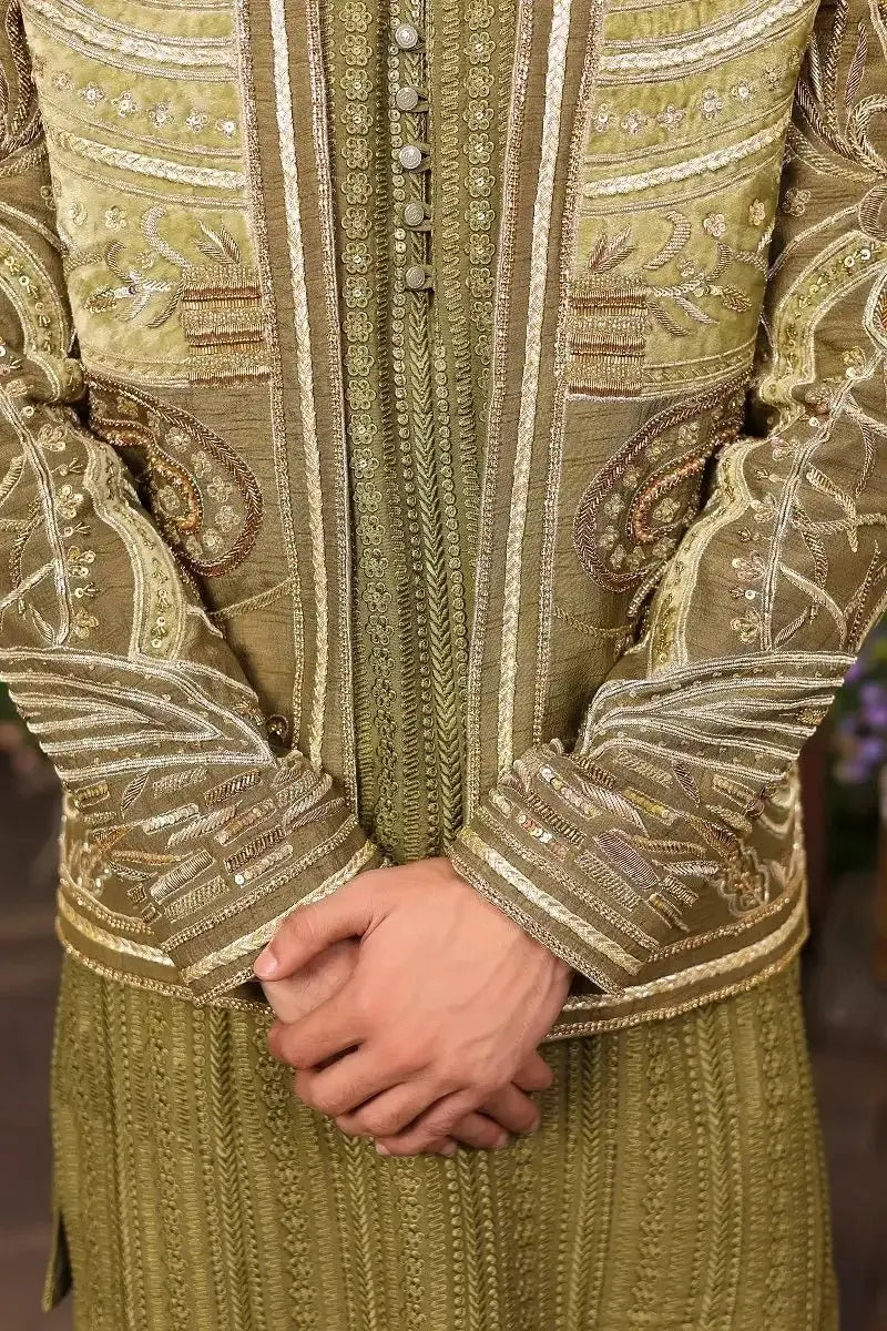 Olive-green sherawala velvet sherwani with gold and silver threadwork paisley motifs sequined raw silk detailing