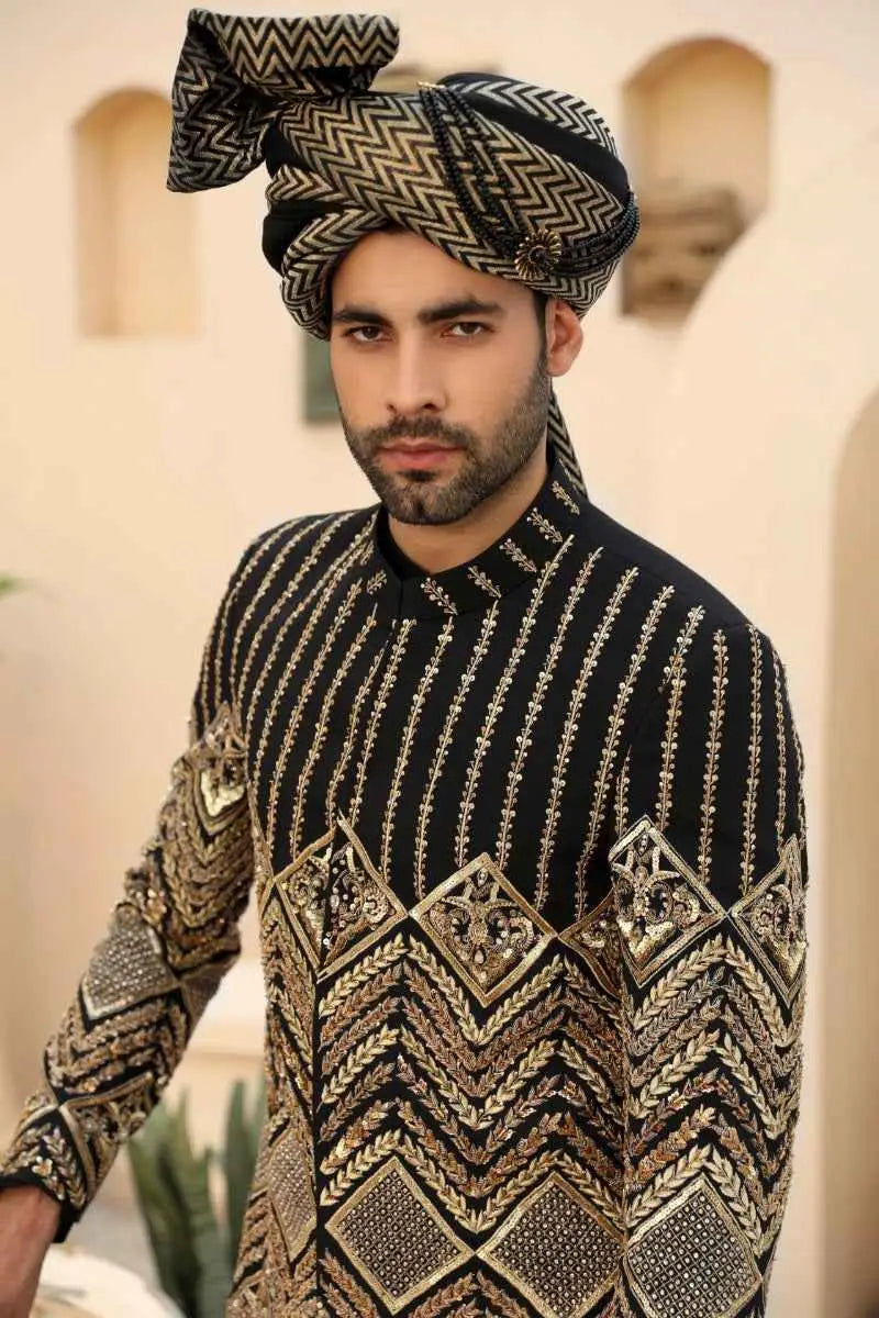 Black and gold embroidered sherwani with intricate geometric patterns from siyah nishaan raqeeb se collection standout piece