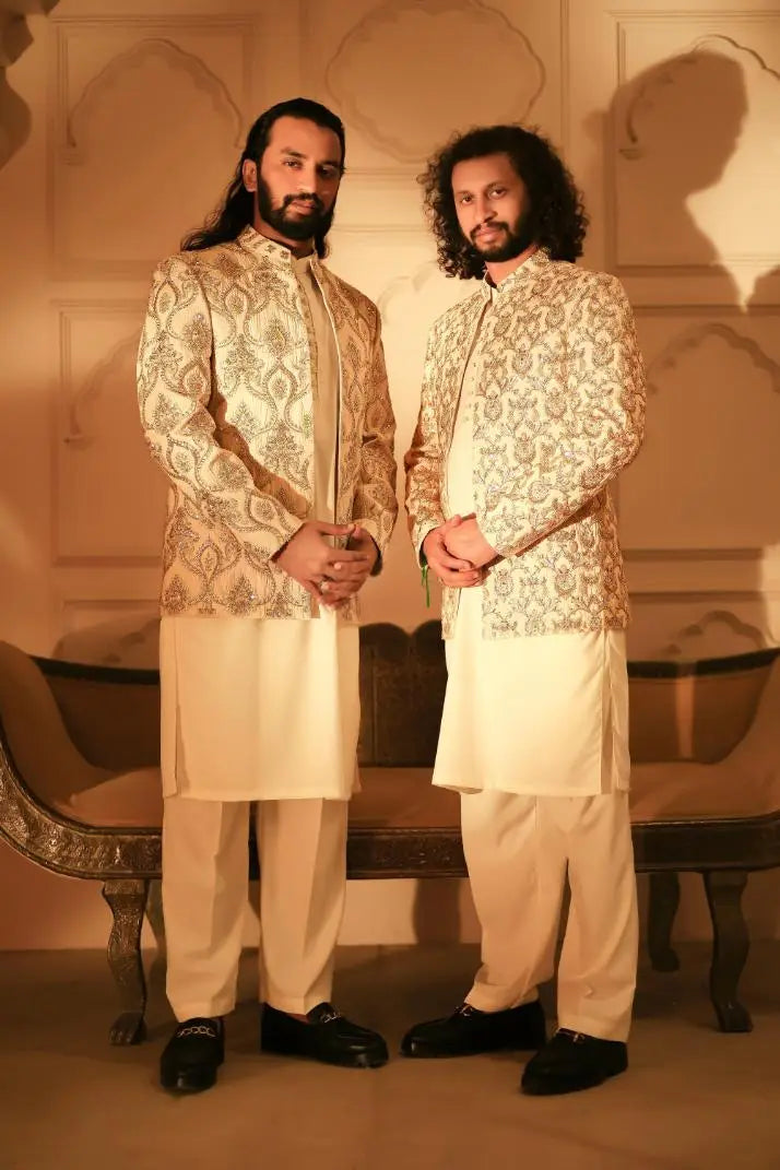 Elegant cream-colored sherwani sultan with intricate gold thread embroidery for formal occasions