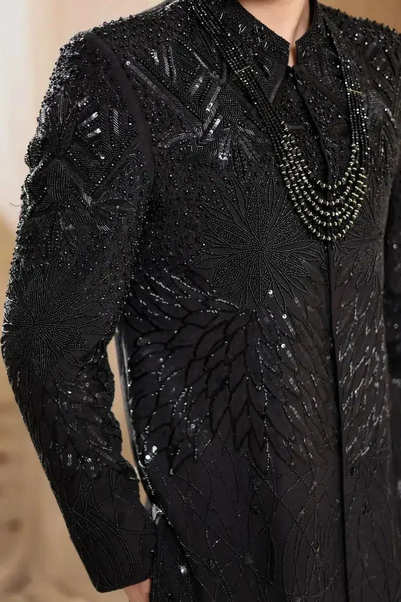 Black embroidered sherwani tajdar in raw silk with intricate beadwork and sequin patterns for formal wear