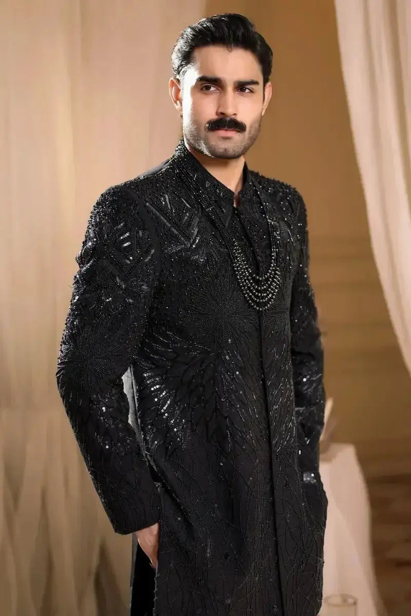 Black embroidered sherwani tajdar with intricate silver beadwork and sequin detailing in raw silk fabric