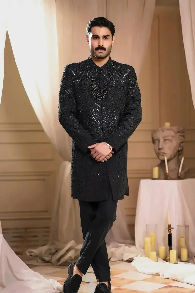 Black sequined raw silk sherwani tajdar with intricate embroidery and beaded neckline for formal occasions
