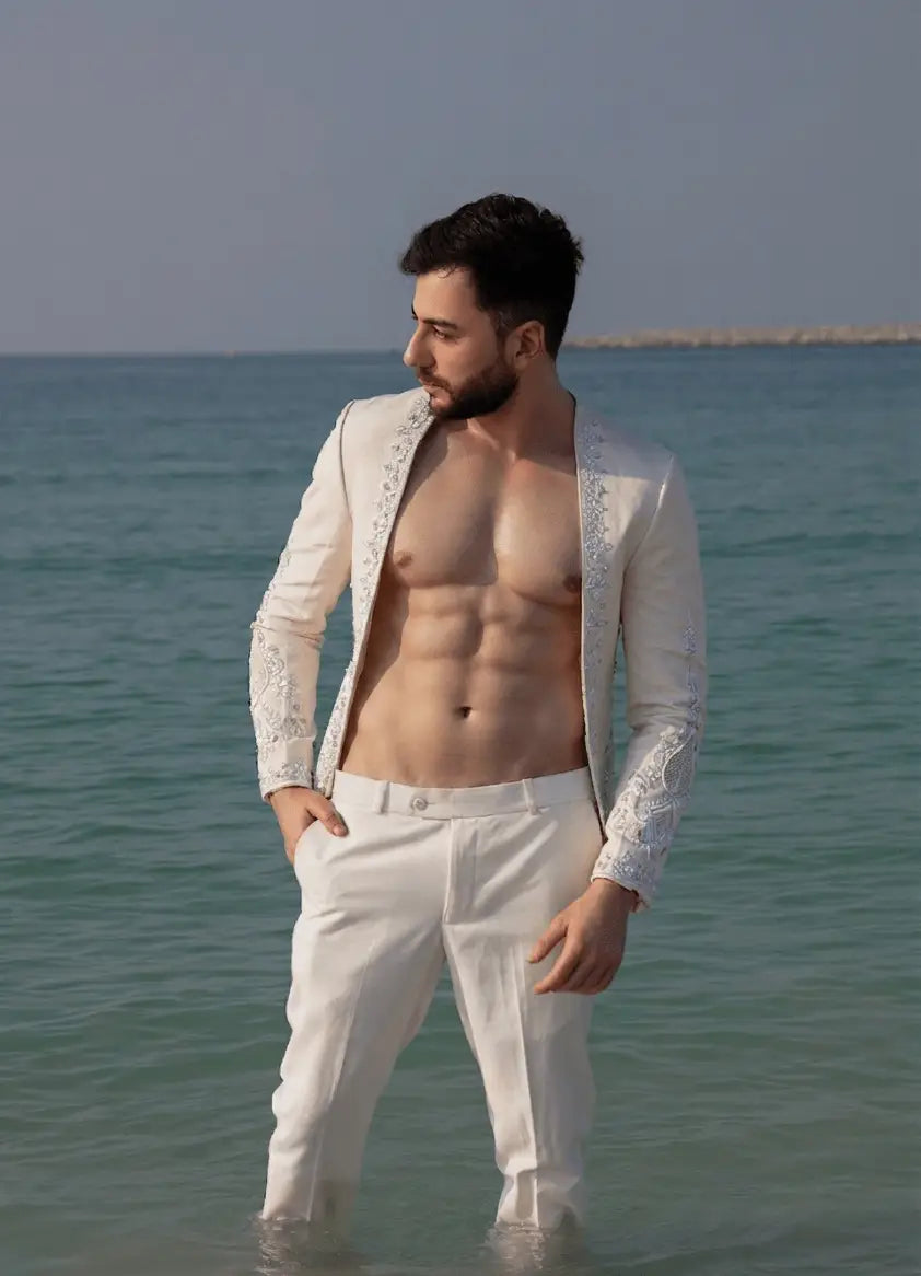 White embroidered blazer tessera with intricate lace detailing showcasing modern transparency and geometric precision