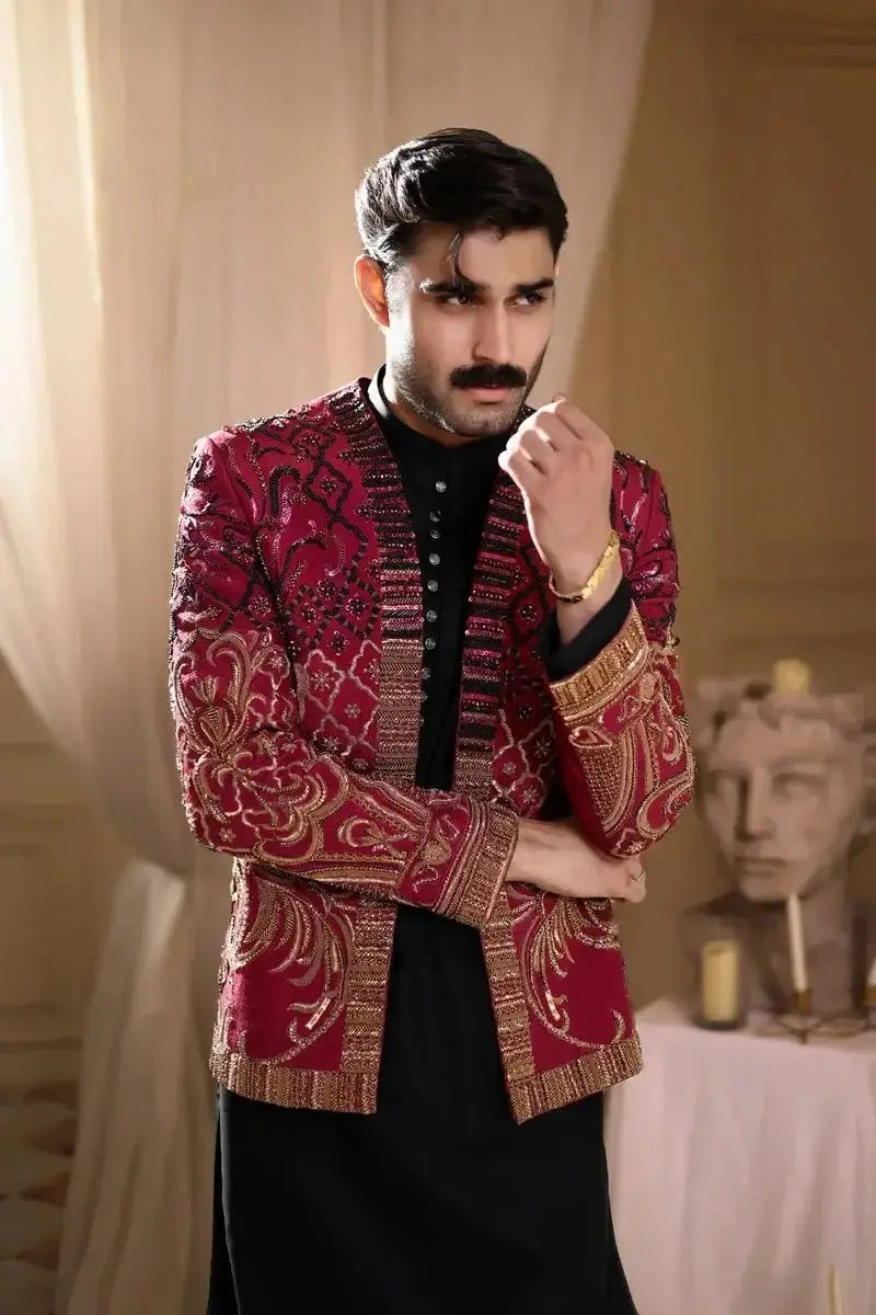 Thakur singh richly embroidered red and gold jacket with intricate paisley patterns and detailed sequin cuffs and hem
