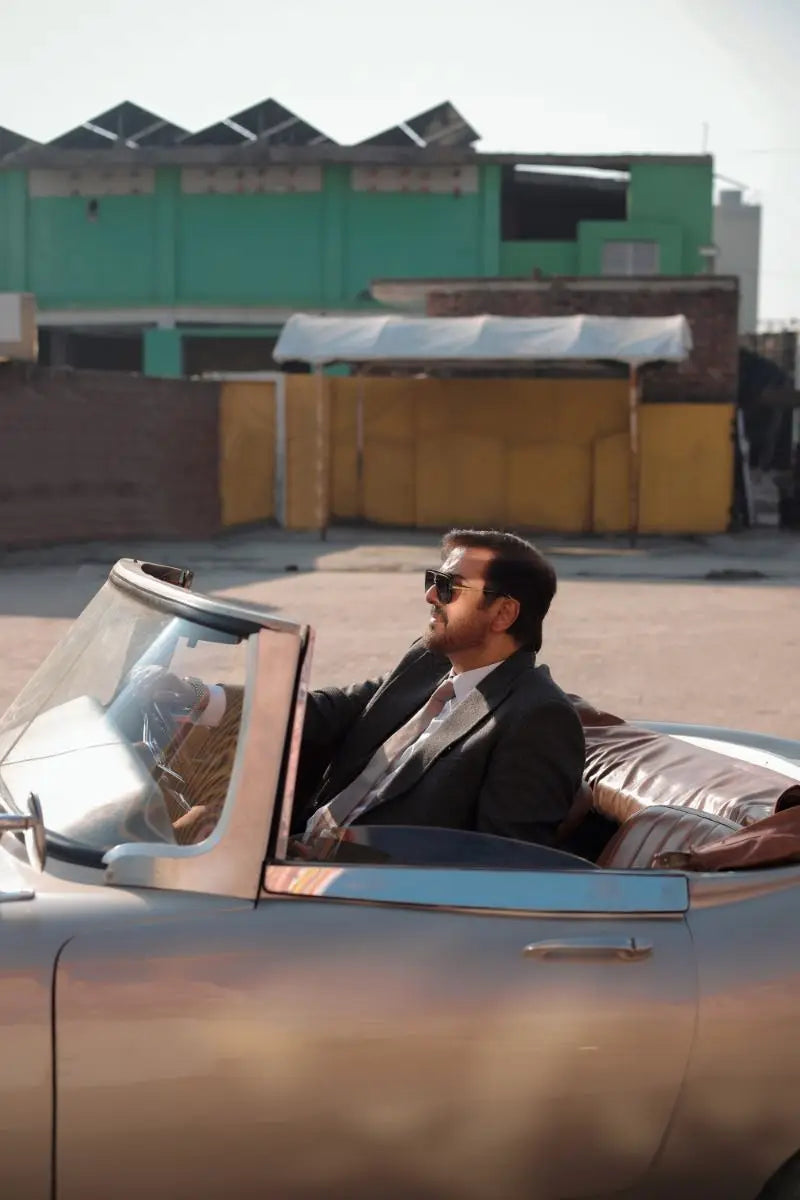Waheed Murad Virsa-e-Sitaaran Edit 26 sleek silver convertible sports car with glossy finish and chrome accents