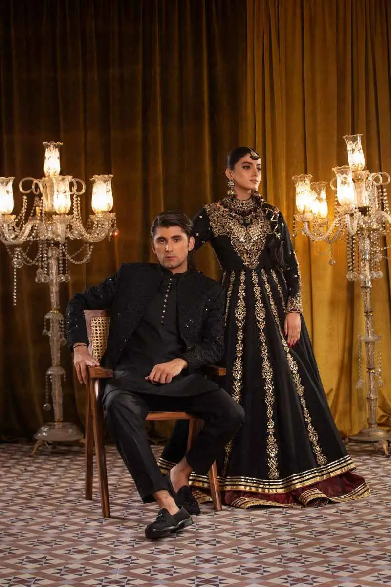 Black and gold embroidered zar taaj ensemble multi-paneled anarkali kalidar with intricate golden threadwork