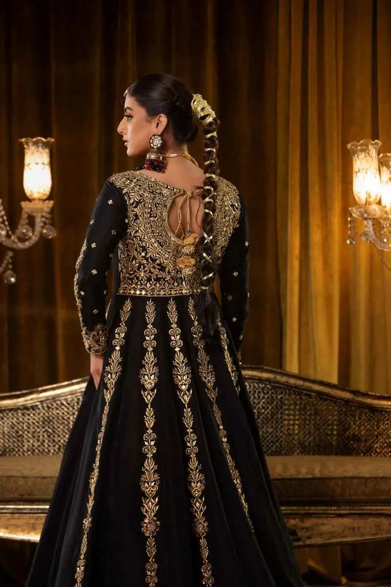 Black gown with intricate gold embroidery and detailed back design from the zar taaj multi-paneled anarkali kalidar ensemble