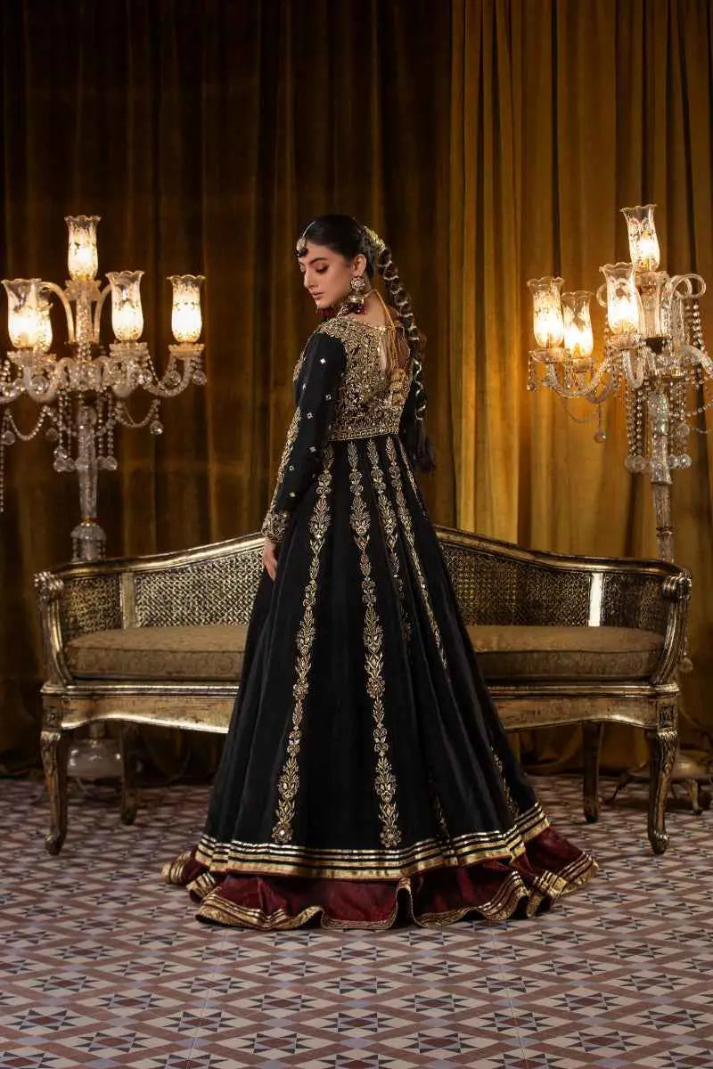 Black velvet zar taaj lehenga with intricate gold embroidery and maroon trim perfect for zar taaj ensemble