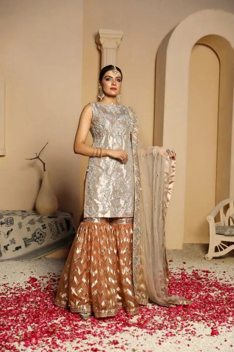 Silver and gold embroidered traditional indian outfit zarrin with fitted top and flared skirt by ahsan tariq raqeeb se edit